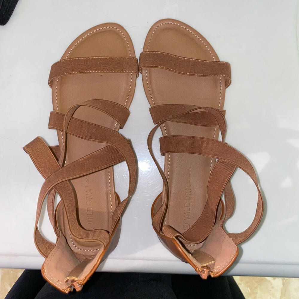 Strappy tan sandals with a zipper in the back